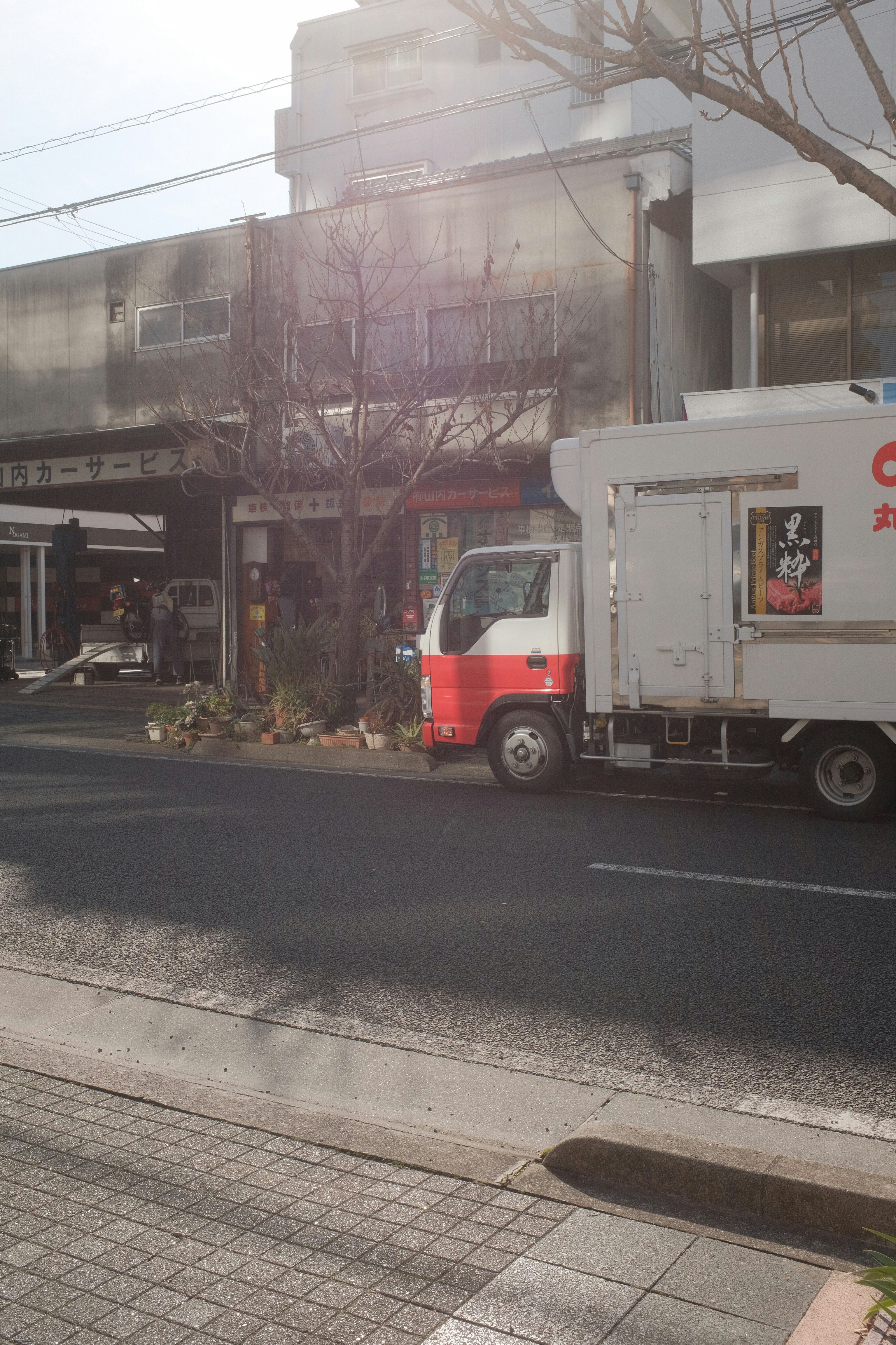 white and red truck on road during daytime